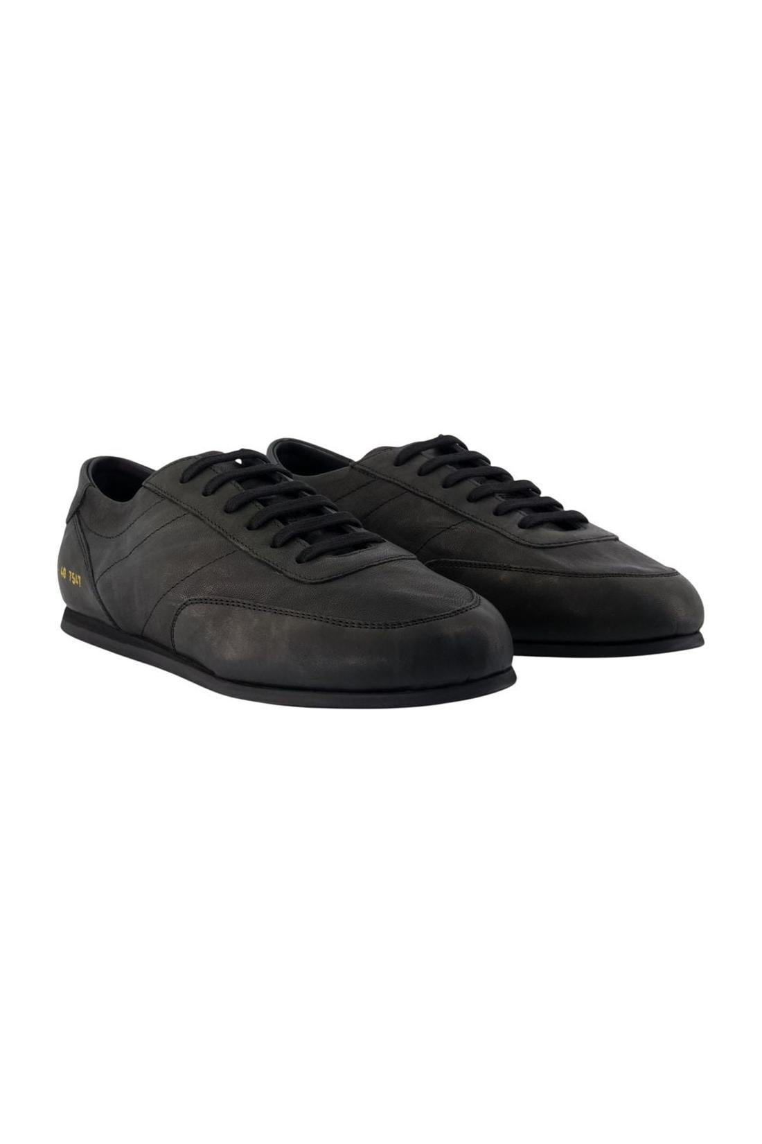 Minimal Sneakers – COMMON PROJECTS – Leder – Schwarz