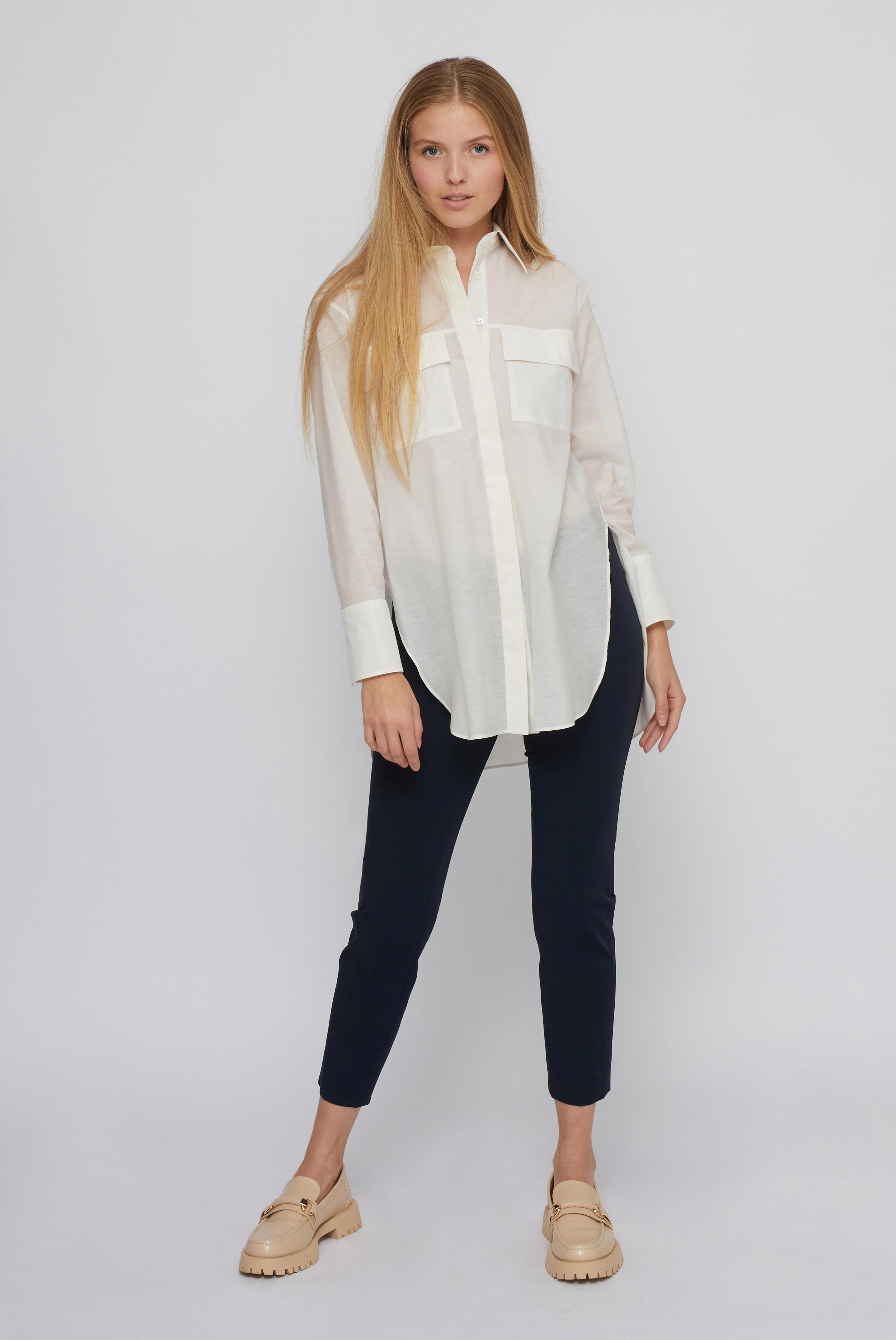 Elegant white shirt blouse with wide cuffs made of blended fabric