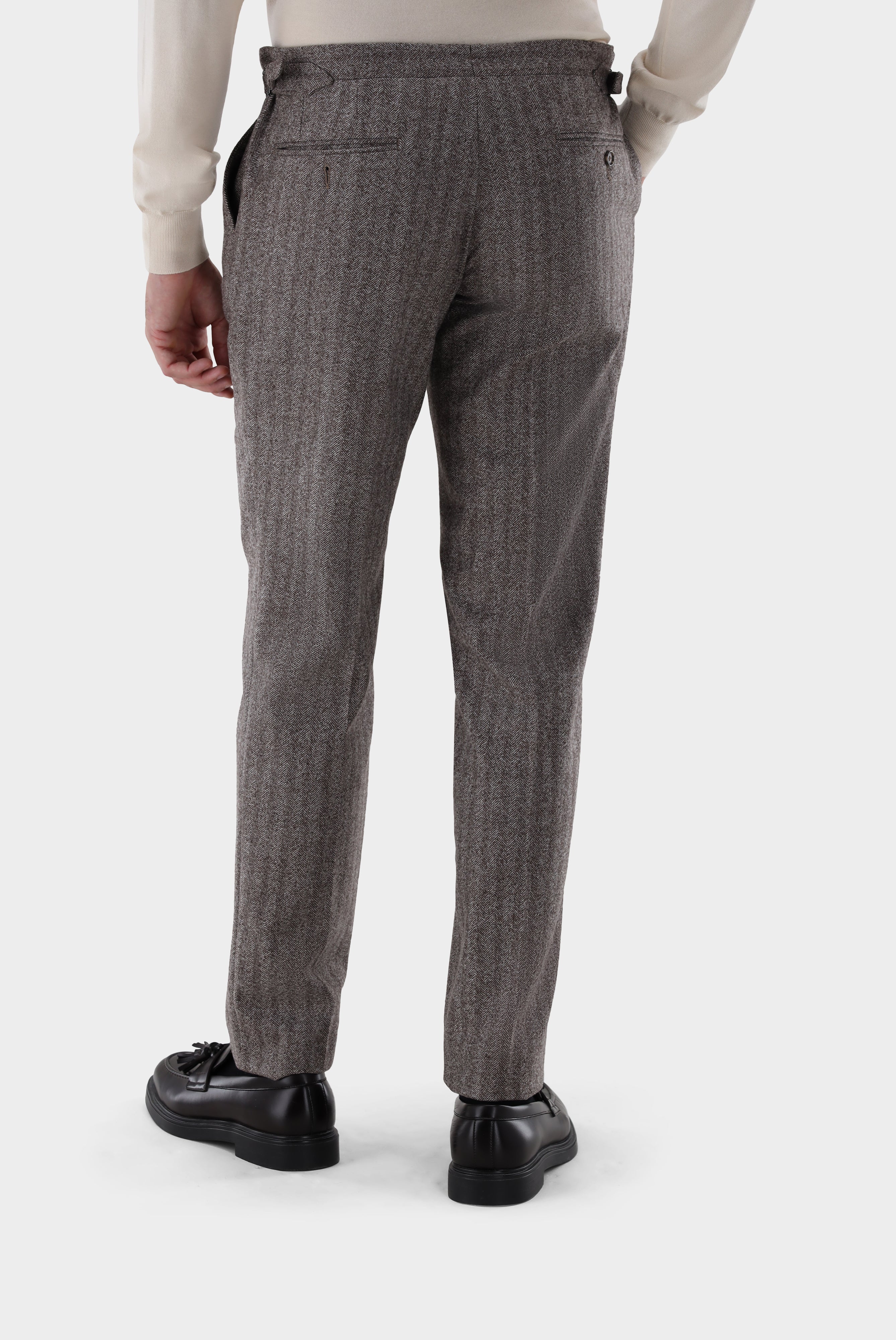 Wool trousers with pleats and herringbone pattern