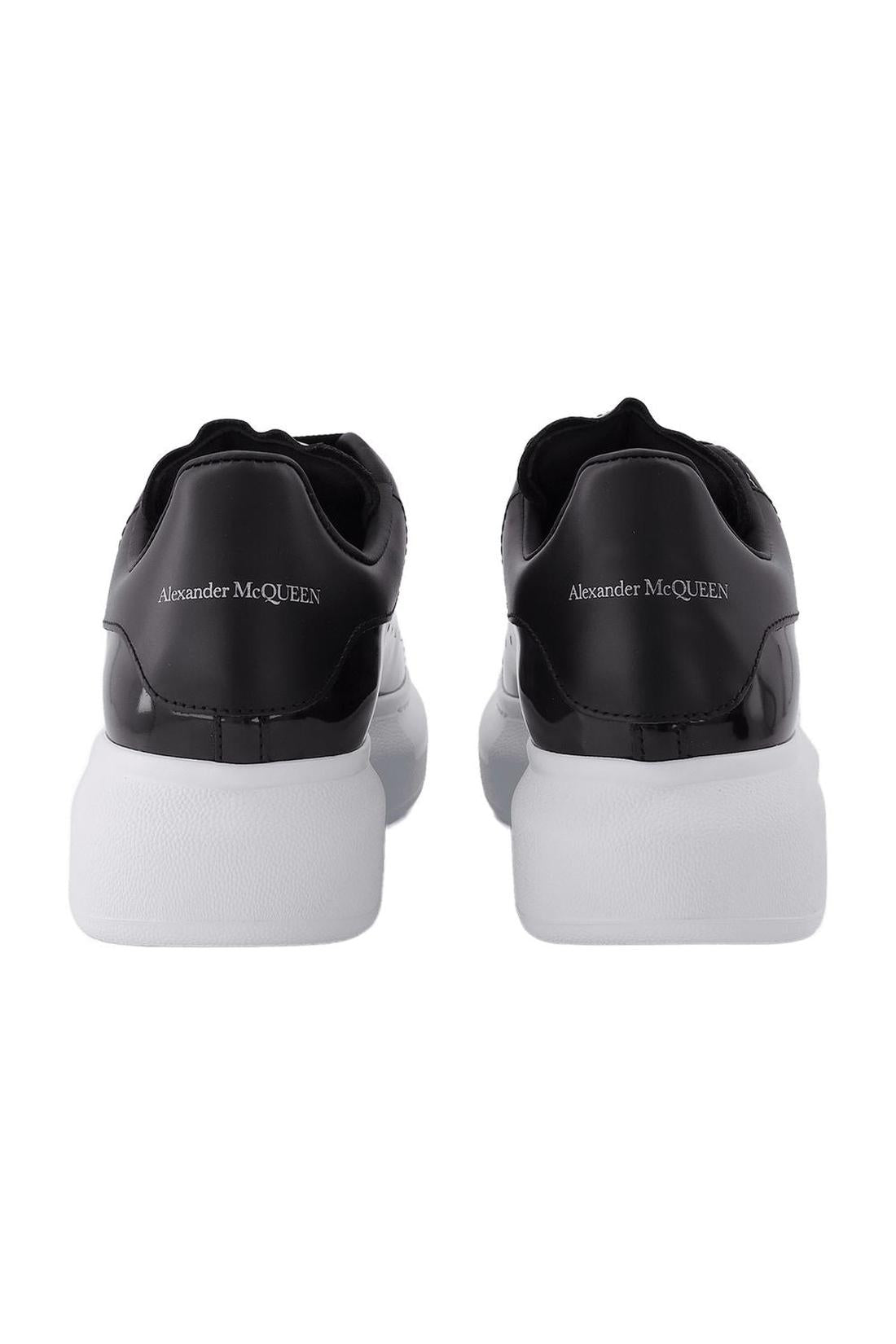 Oversized black leather sneakers