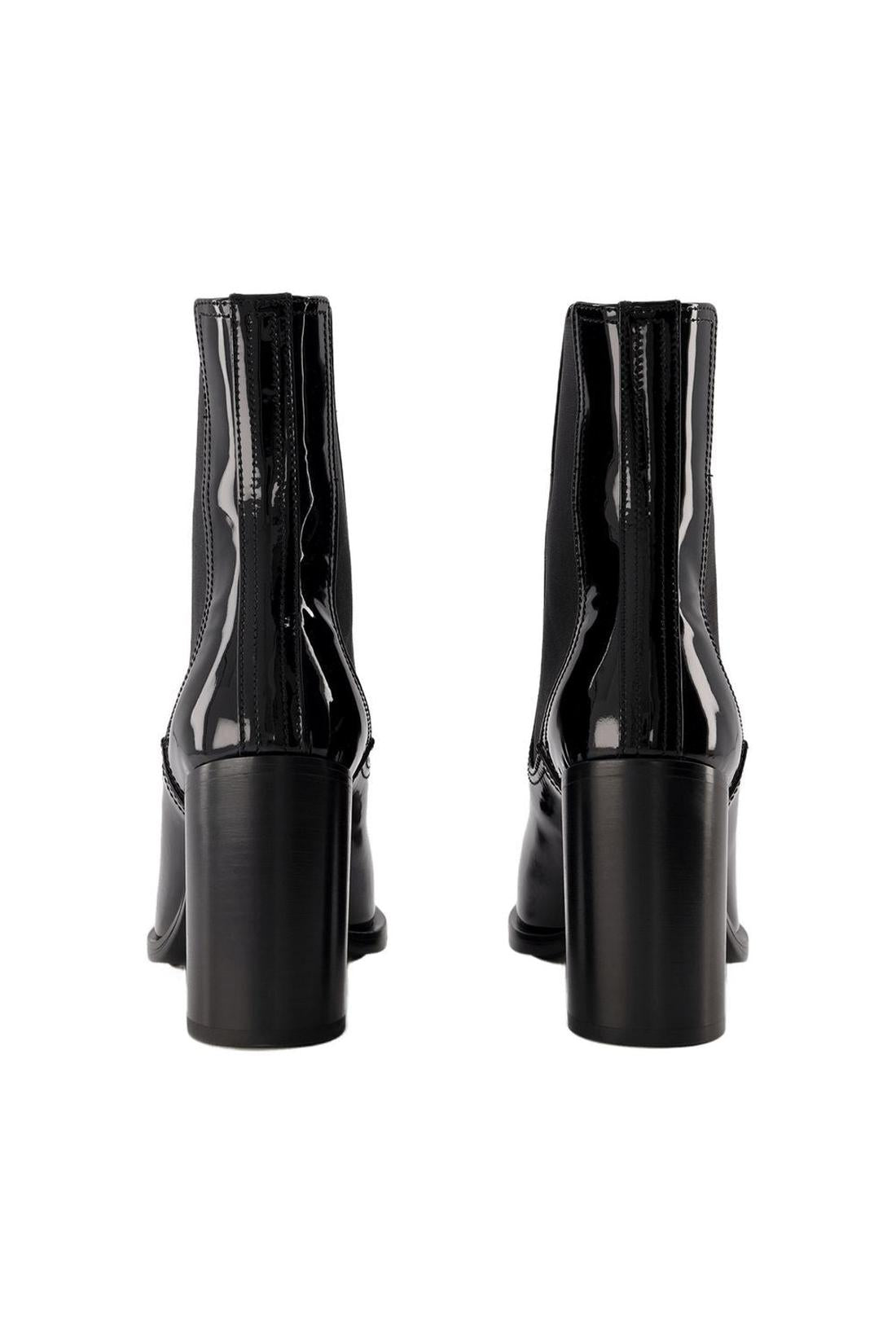 Stiefeletten aus schwarzem und silberfarbenem Leder