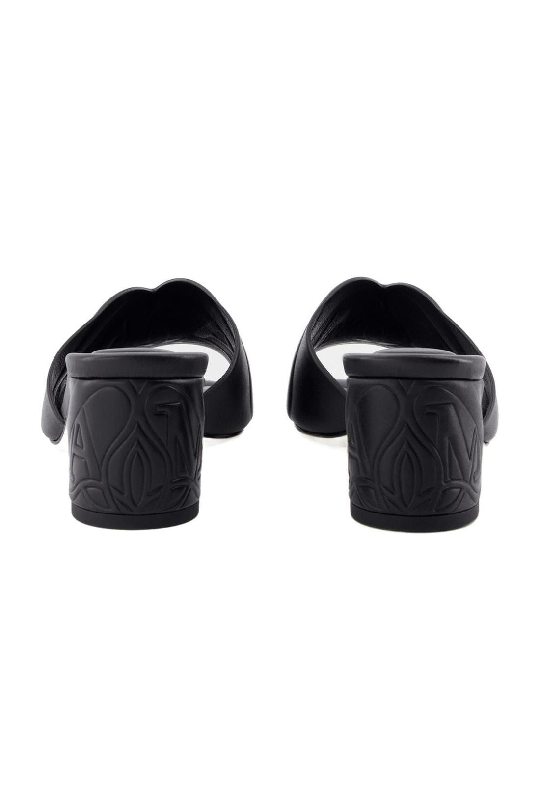 Seal heeled sandals - Alexander McQueen - leather - black