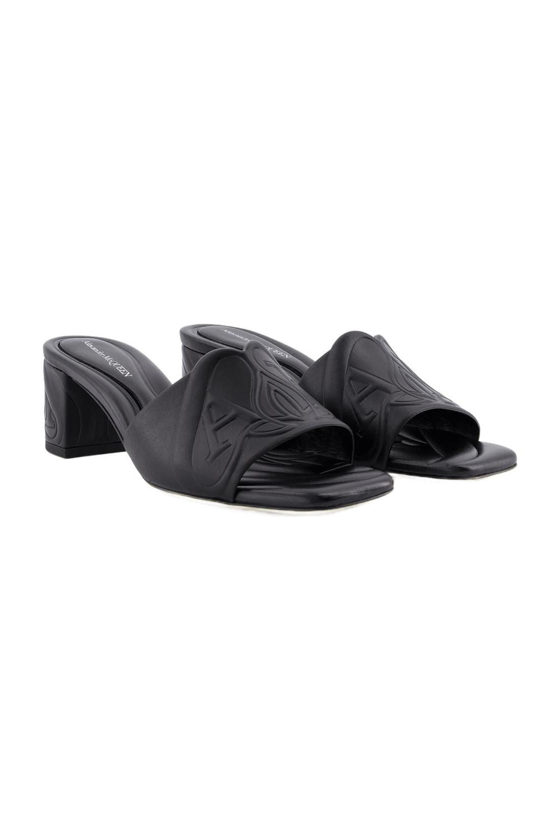 Seal heeled sandals - Alexander McQueen - leather - black