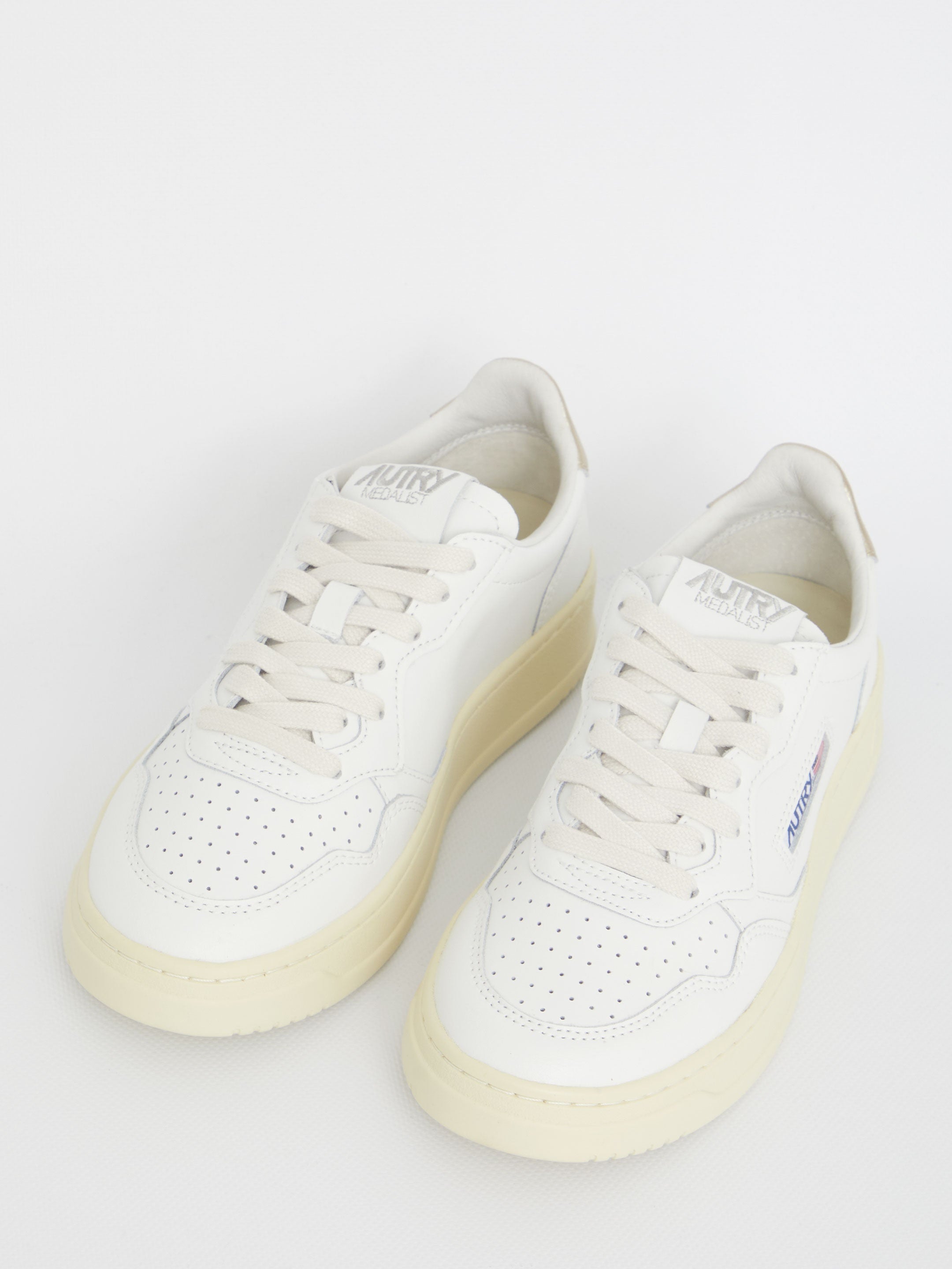 Medalist white and gold sneakers