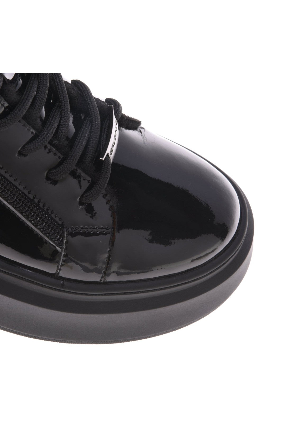 Black patent trainer