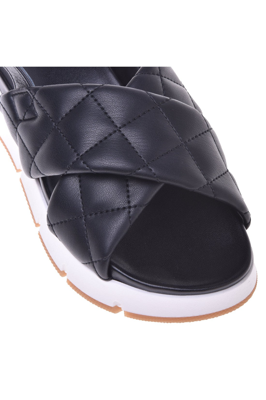 Sandal in black quilted leather