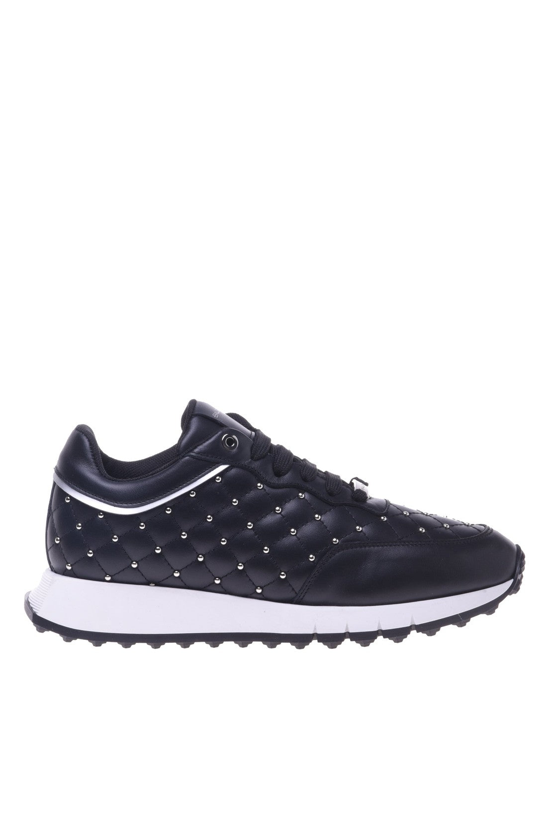 Trainers in black quilted leather