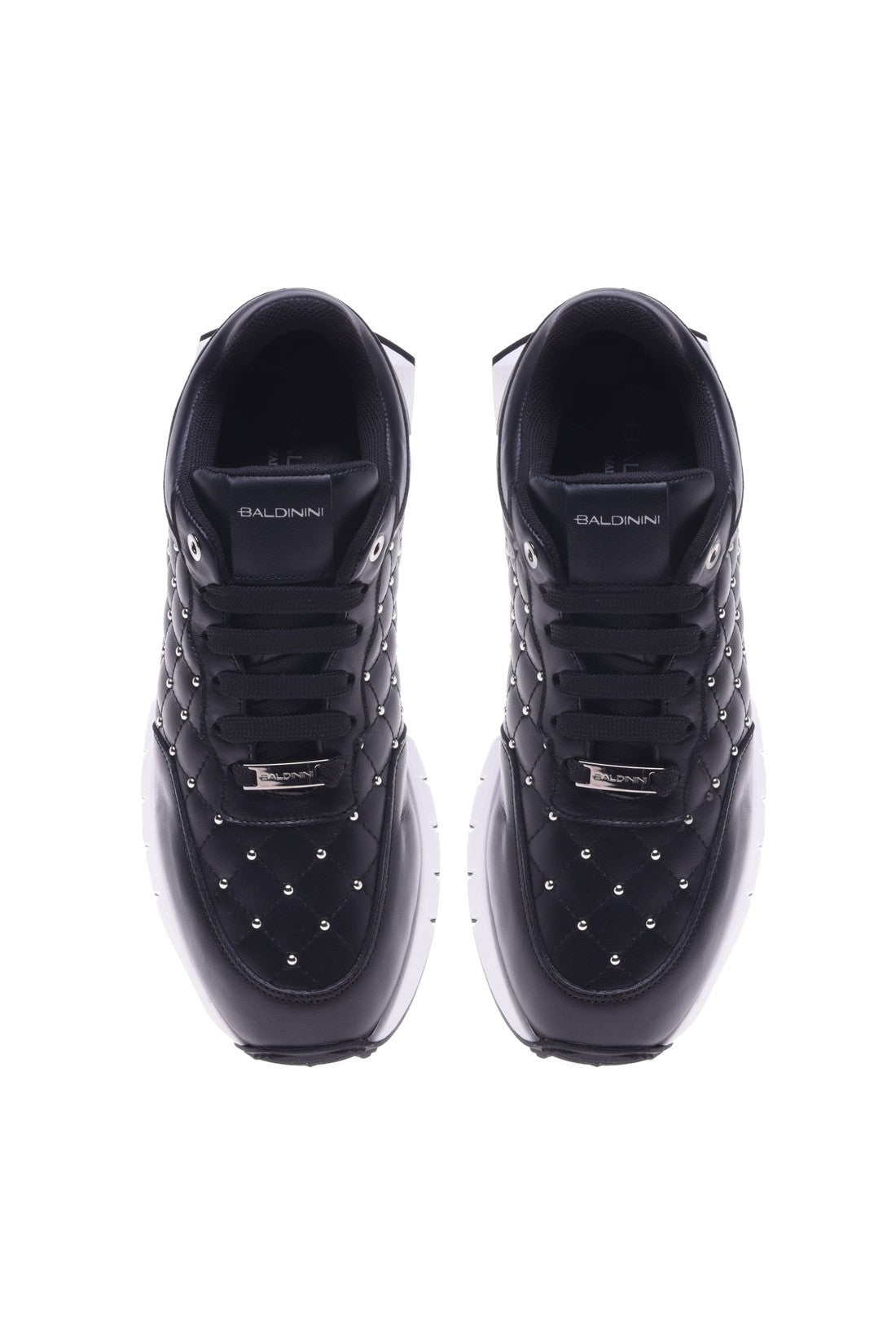 Trainers in black quilted leather