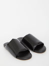 Black leather slides