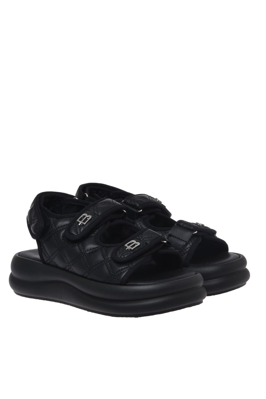 Sandal in black quilted faux leather