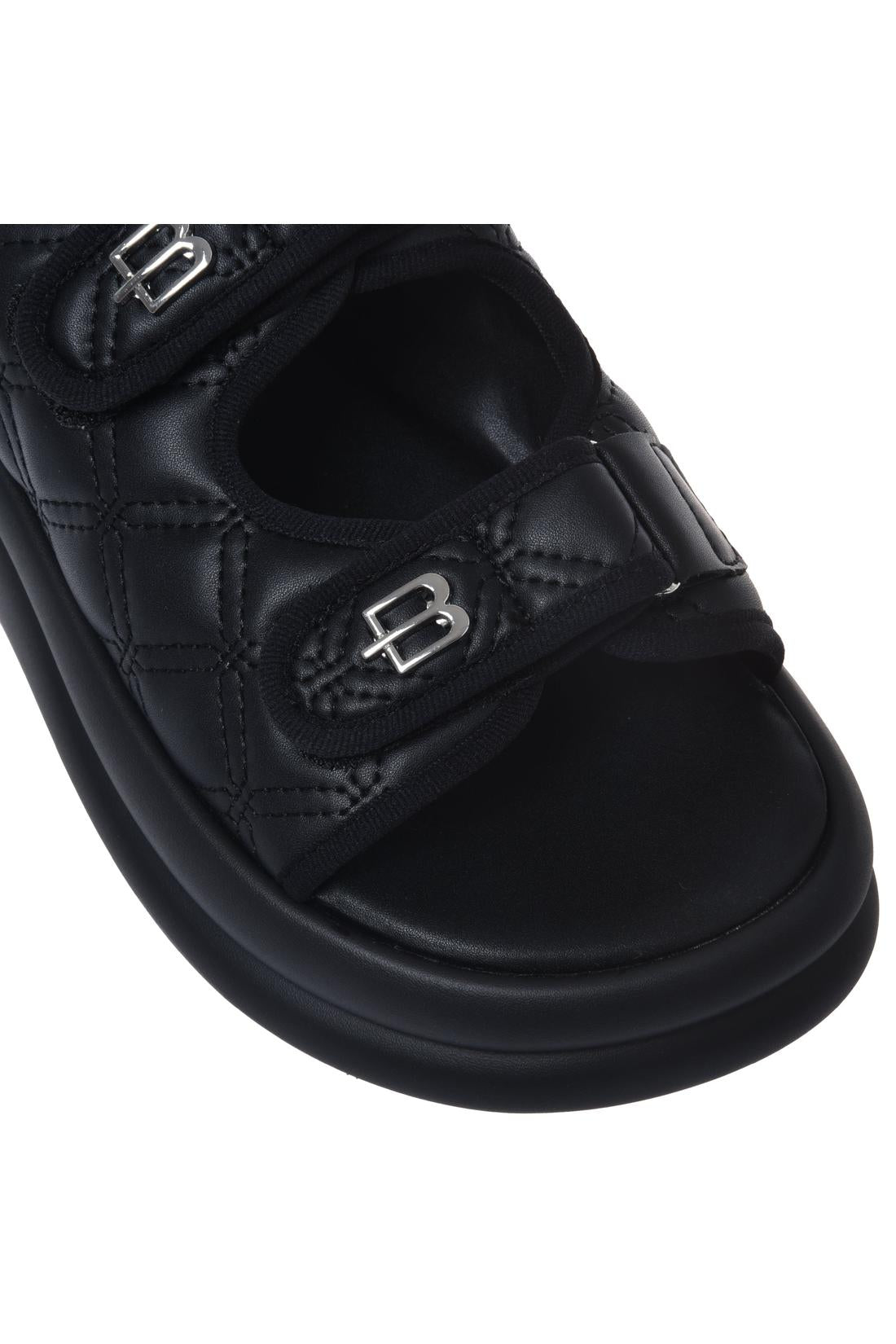Sandal in black quilted faux leather