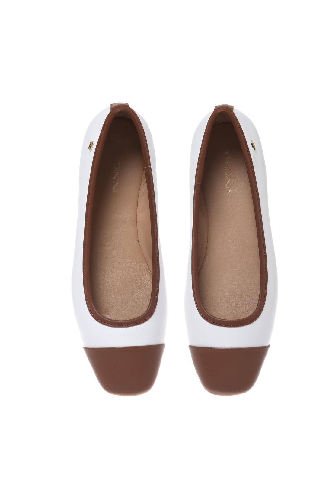 Ballerina in tan and white leather