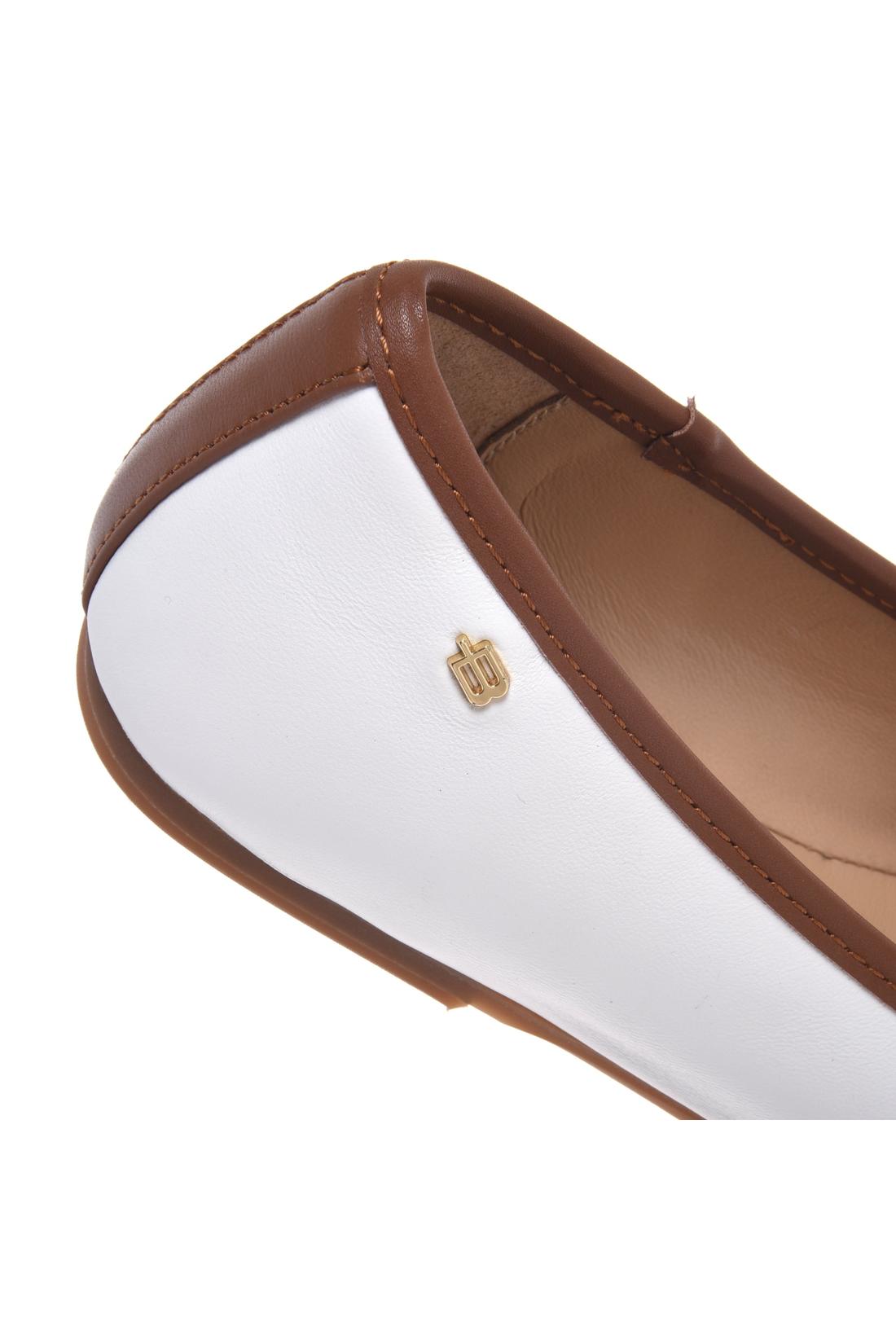 Ballerina in tan and white leather