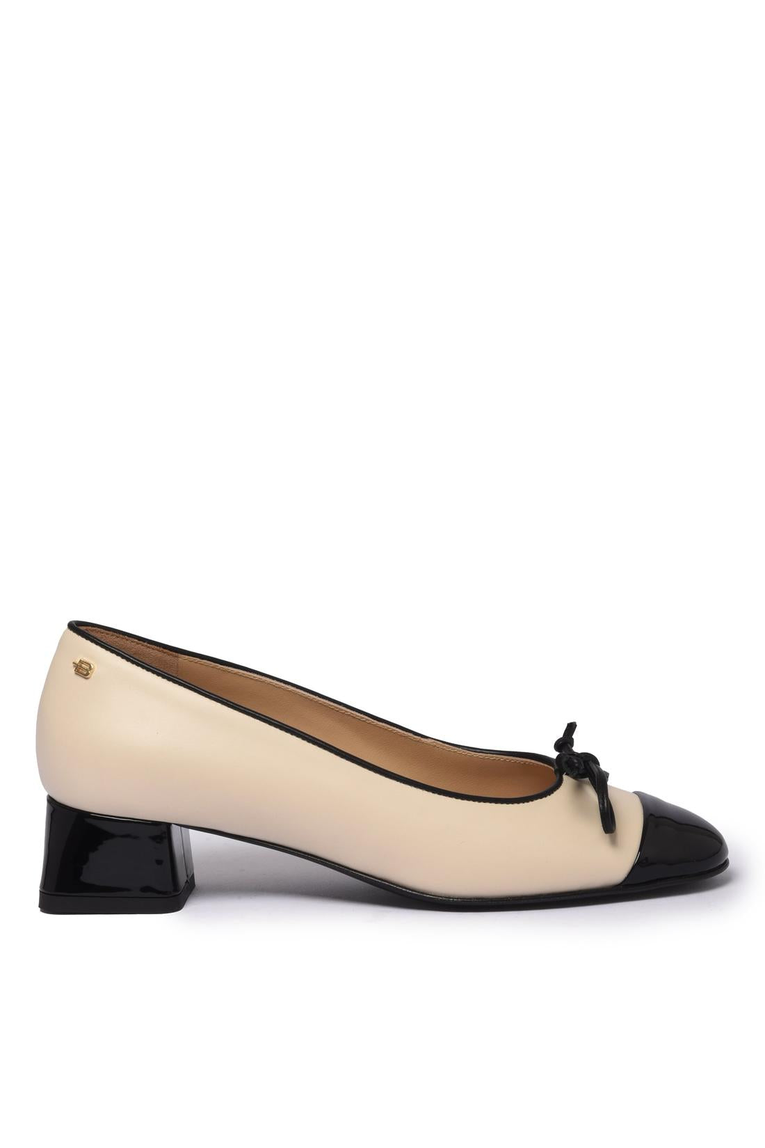 Black patent leather and off-white leather pump