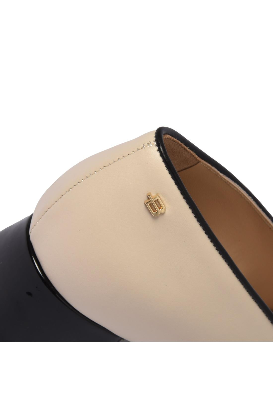 Black patent leather and off-white leather pump