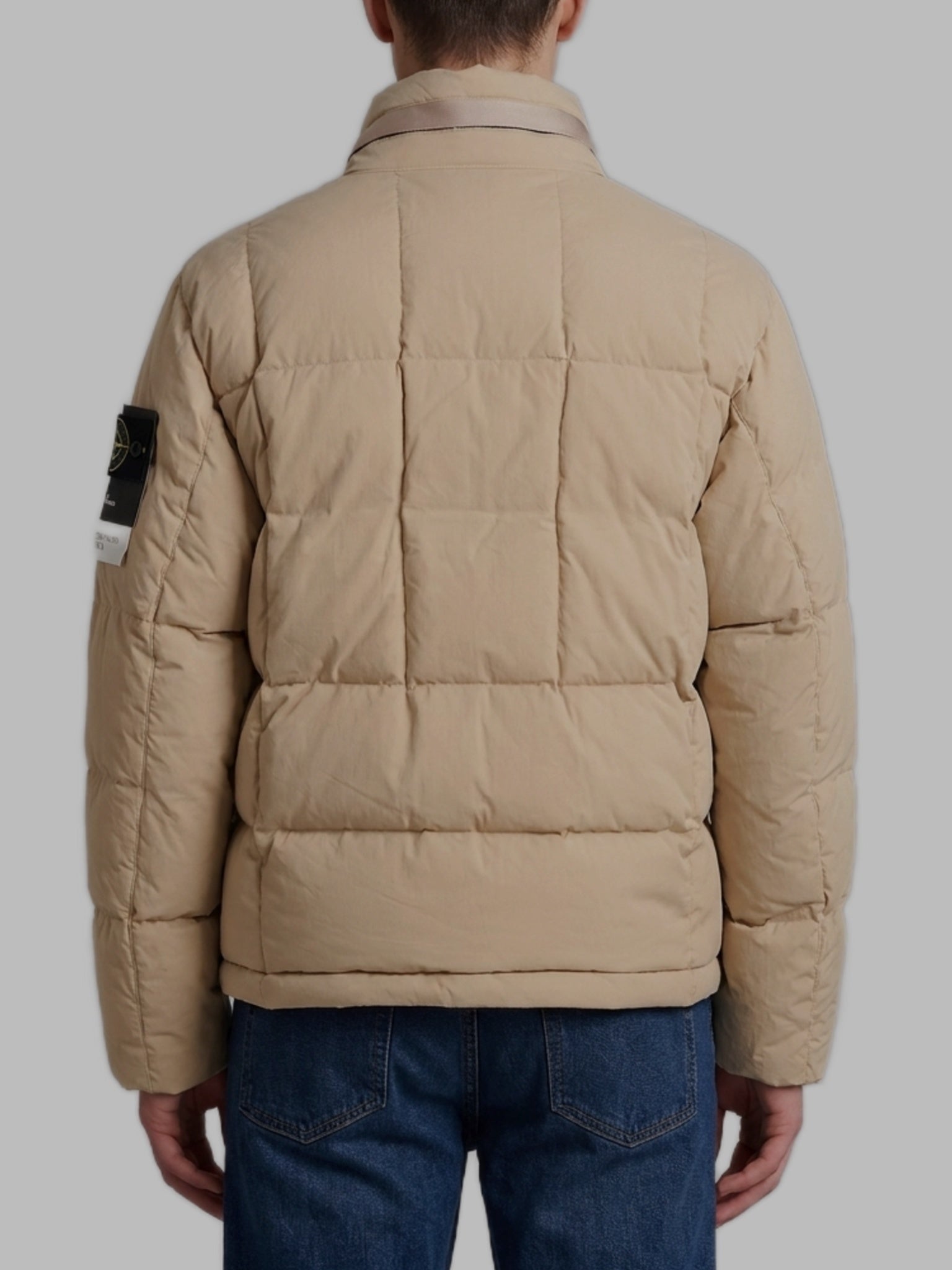 Beige cotton and nylon canvas down jacket.