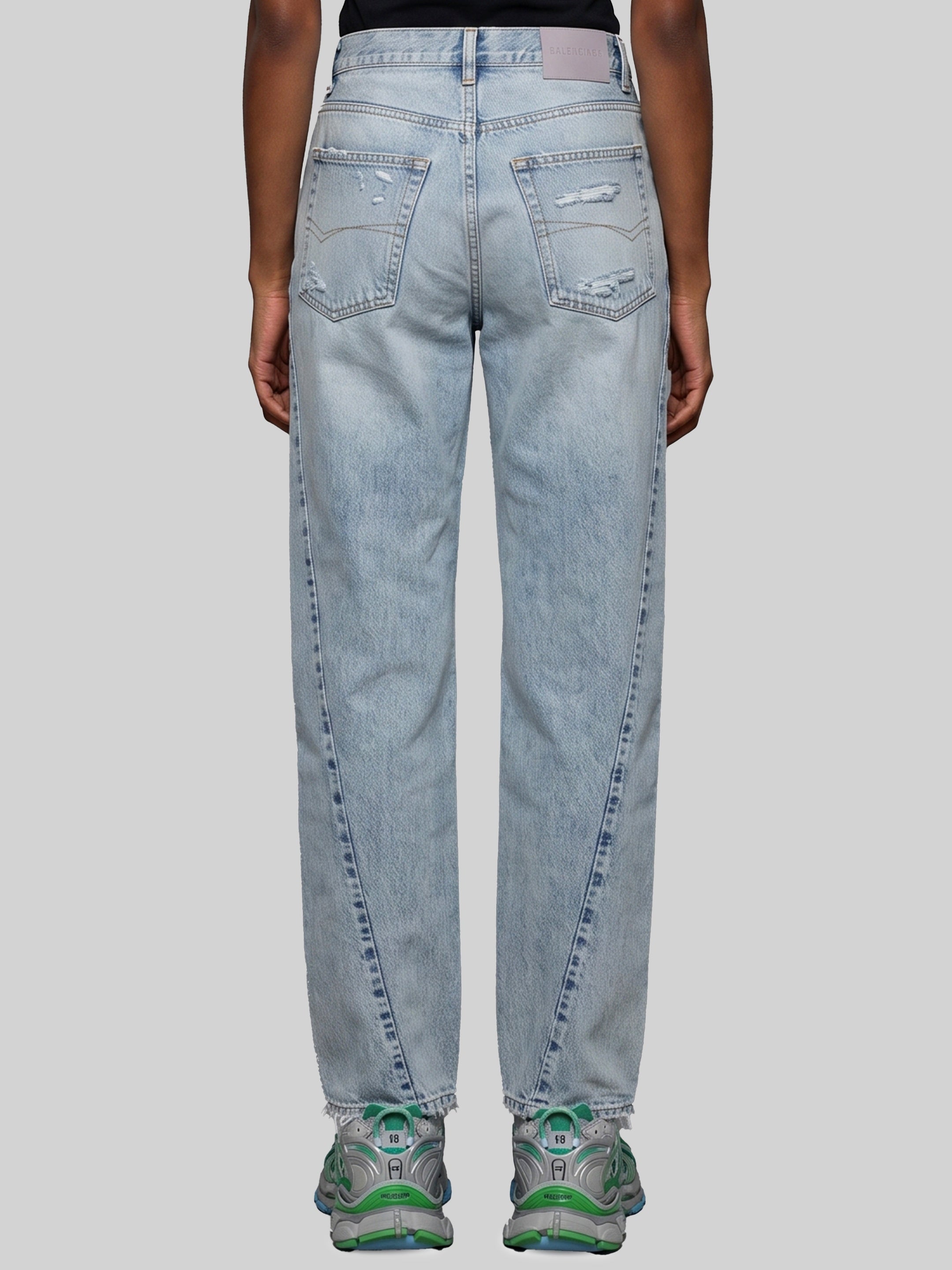 Light blue faded jeans with twisted seams