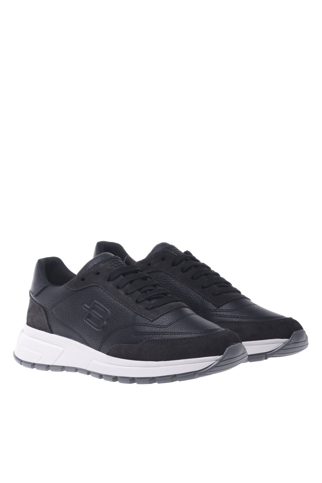 Trainers in black leather and tumbled leather