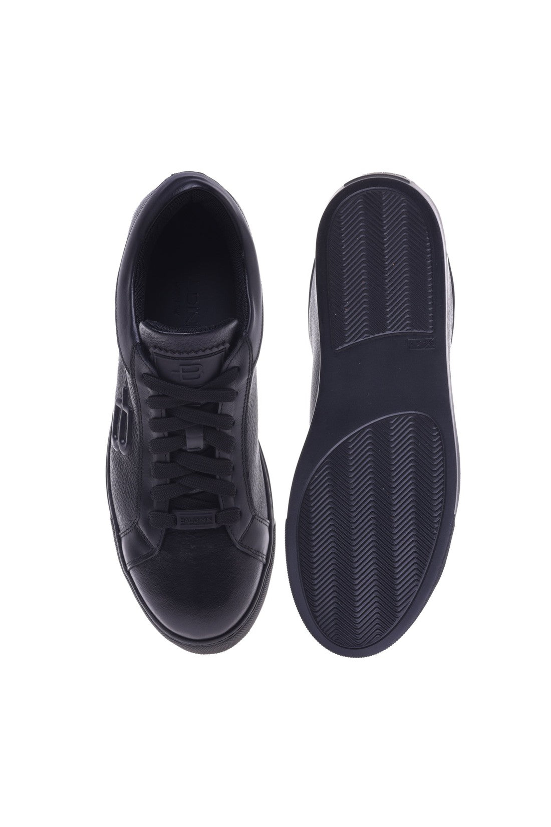 Trainers in black tumbled leather