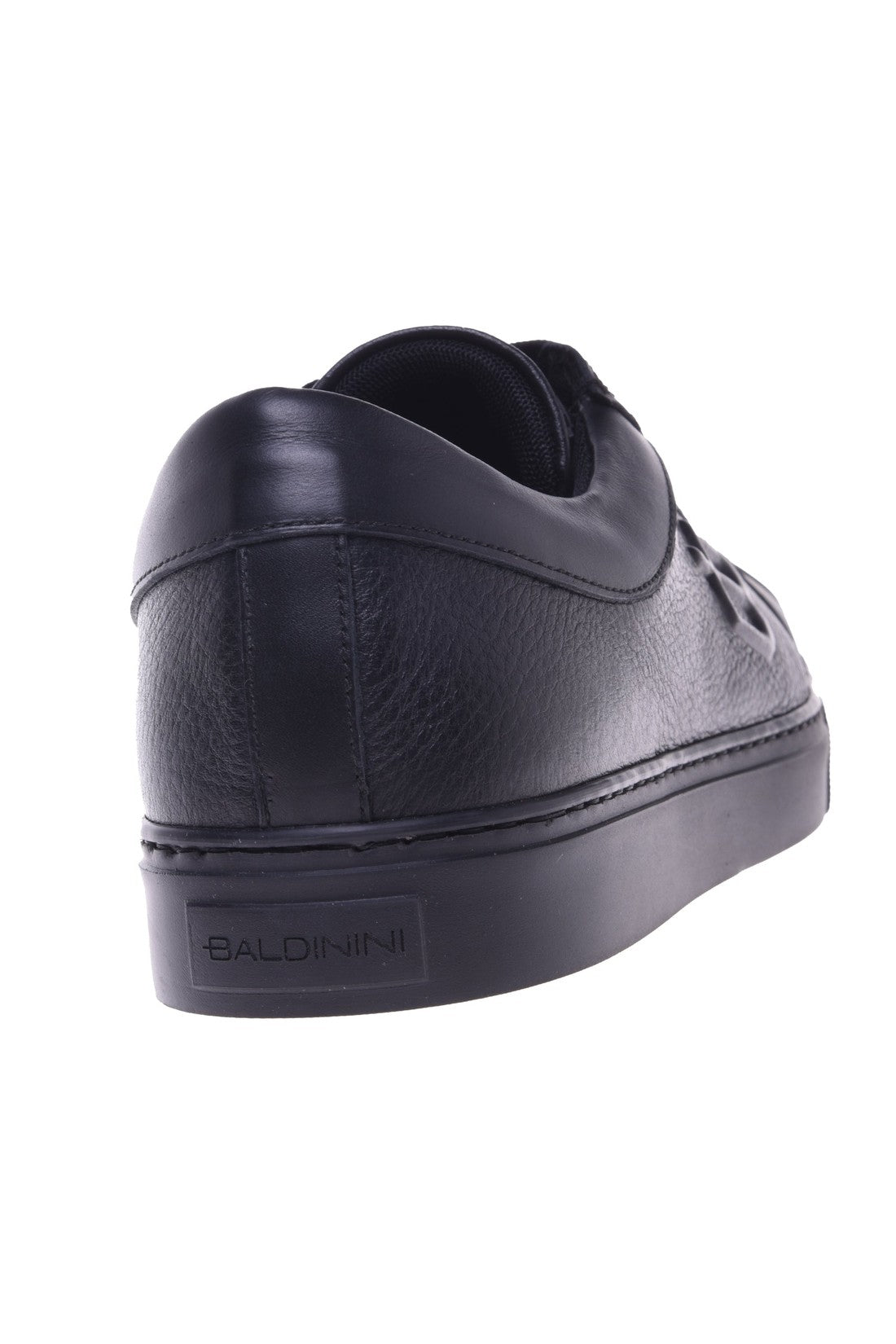 Trainers in black tumbled leather